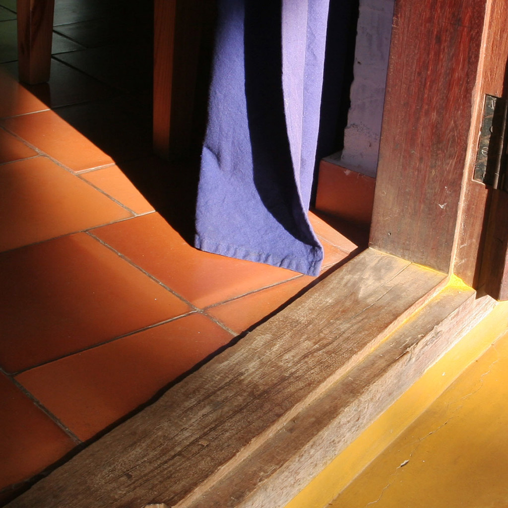 Terracotta floor and yellow oxide floor, wooden frame finished with cashew shell oil and linseed oil.