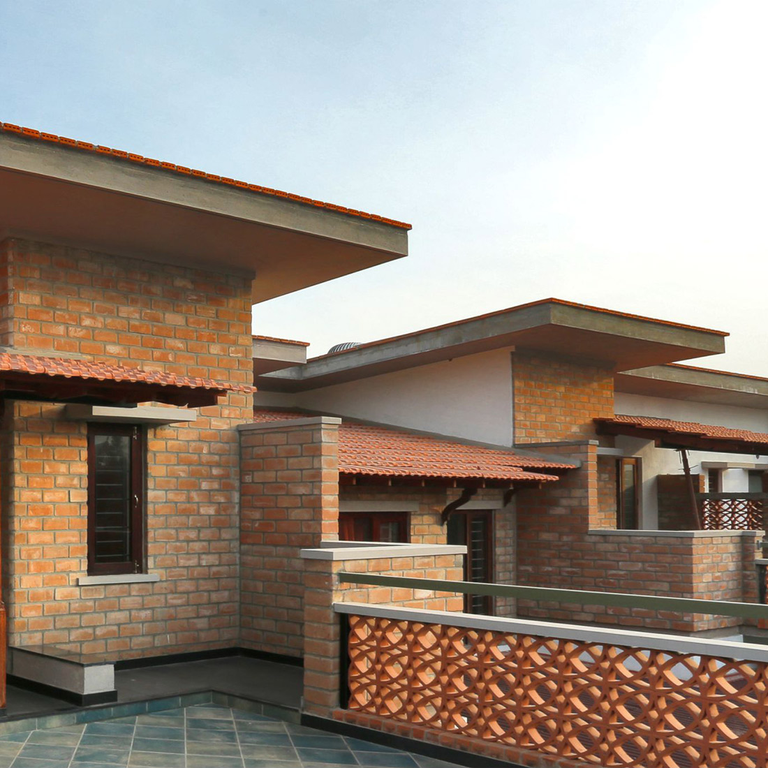 The RCC roof is cladded with hollow terracotta tiles to keep the inside of the house cool.