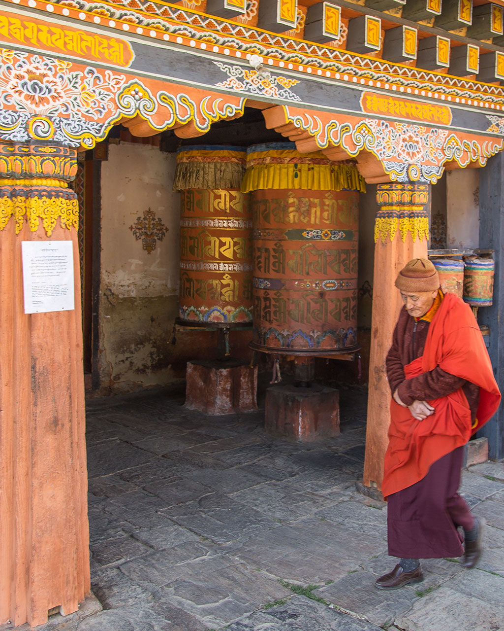 Giant prayer wheels that keep rotating on a festival day.